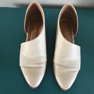 Cream slip ons in “snakeskin” texture